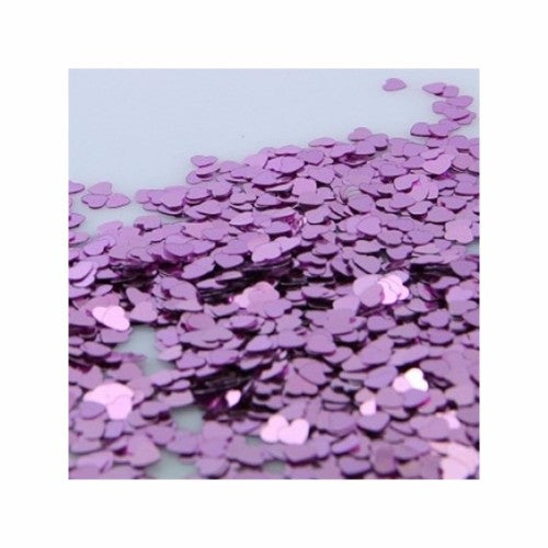Heart-shaped pink confetti pack for weddings and celebrations, ideal for table scattering and party decorations.