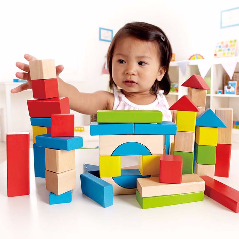 Colorful Hape Maple Blocks set for creative building, featuring 50 durable wooden pieces for safe and imaginative play.