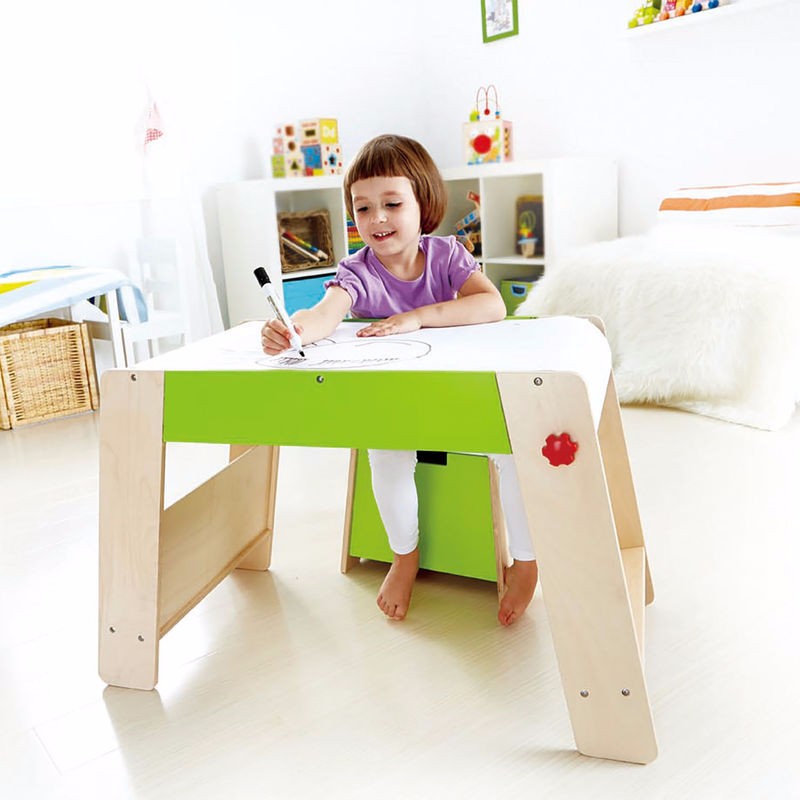 Kid-sized wooden art table and stool set for creative play, featuring a storage seat for art supplies.