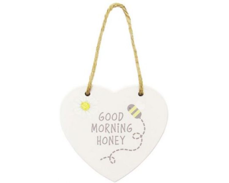 Heart-shaped wooden sign with twine hanger, celebrating bees; perfect for home decor or gifts for bee lovers.