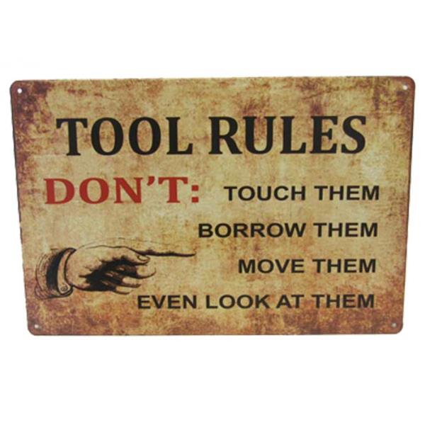 Vintage-inspired tin sign showcasing quirky tool rules, perfect for garages and man caves, measuring 30cm x 20cm.