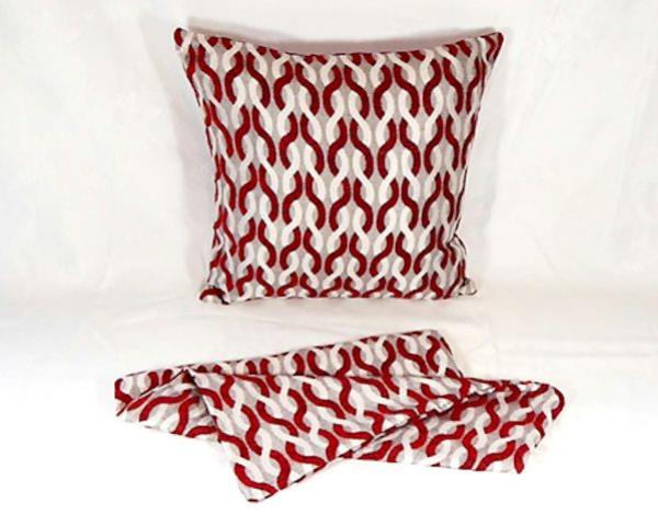 Vibrant red cushion cover measuring 44cm x 44cm, featuring easy zip access for washing, perfect for enhancing any decor.