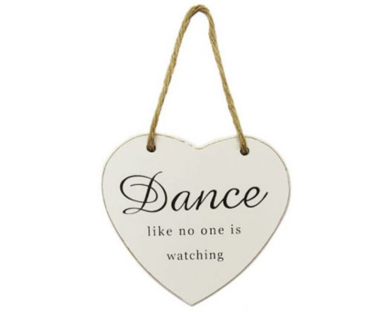 Heart-shaped wall decor in white, featuring inspirational words on a rope, perfect for dancing rooms and joyful spaces.