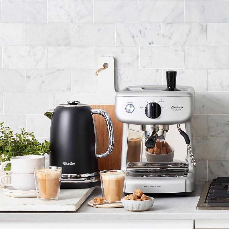 Sunbeam Mini Barista Espresso Machine in silver, featuring a 15-bar pump and 2L tank for cafe-quality espresso at home.