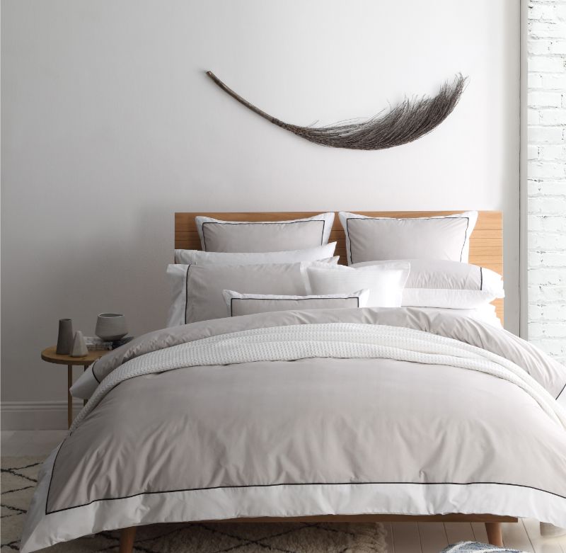 Super King Duvet Cover Set in Essex Stone, featuring herringbone pattern and chic black piping, perfect for elegant bedrooms.