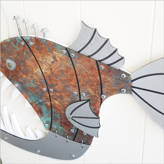 Layered fish wall art displaying intricate 3D design, perfect for fishing enthusiasts' decor, ready to hang.