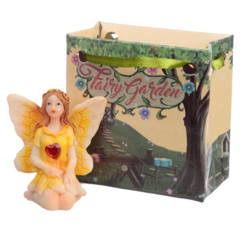 Colorful gemstone fairy figures in mini gift bags, perfectly packaged for charming gifts and special occasions.