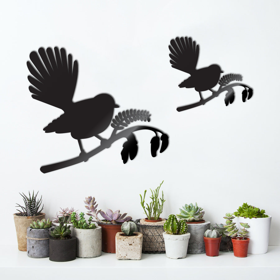 Kiwiana wall art featuring a Fantail bird on a vibrant Kowhai tree, crafted from lightweight mirror acrylic for elegant indoor display.