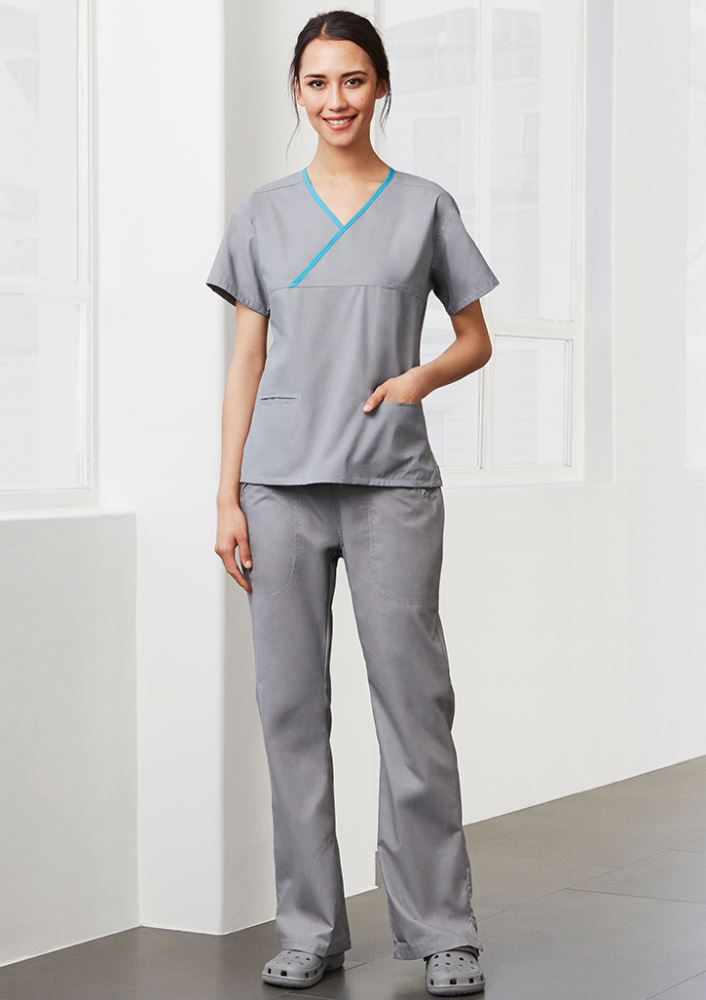 Ladies Mid Blue/Navy scrubs top with crossover design, contrast trim, and 2 front pockets for healthcare professionals.