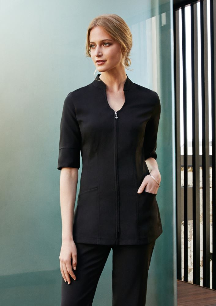 Ladies Bliss Tunic in Black/Black, Size 16, featuring stretch fabric, 2-way zip, and pockets for stylish comfort.