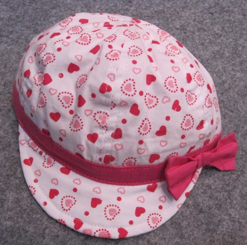 Adorable Pink Hearts Soft Cap for babies, 43CM, ensuring comfort and style with a snug fit and playful design for ages 3-9 months.