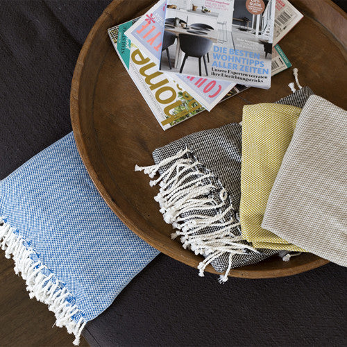 Elegant 100% cotton basket weave throw in raven color, perfect for warmth and stylish home decor enhancement.