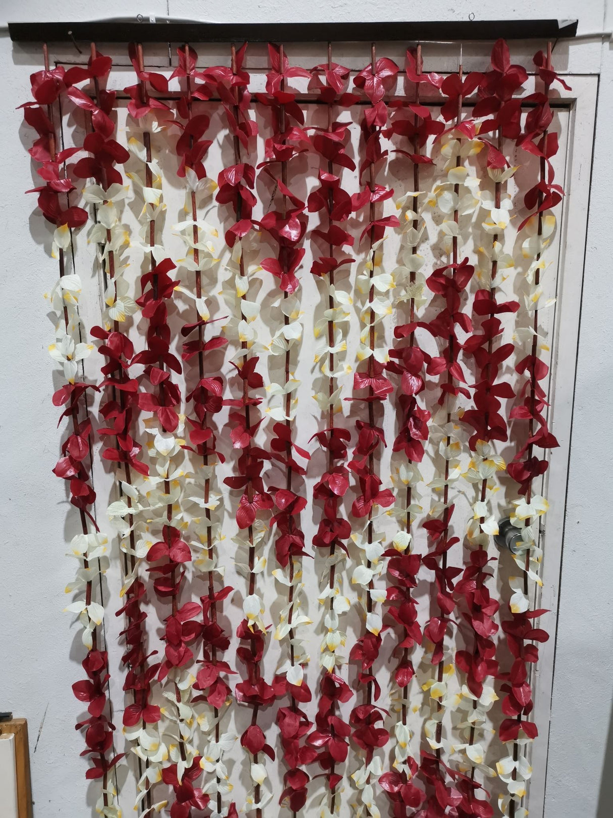 Elegant bead curtain with leaf design, perfect for privacy and light filtering in any room or event decor.