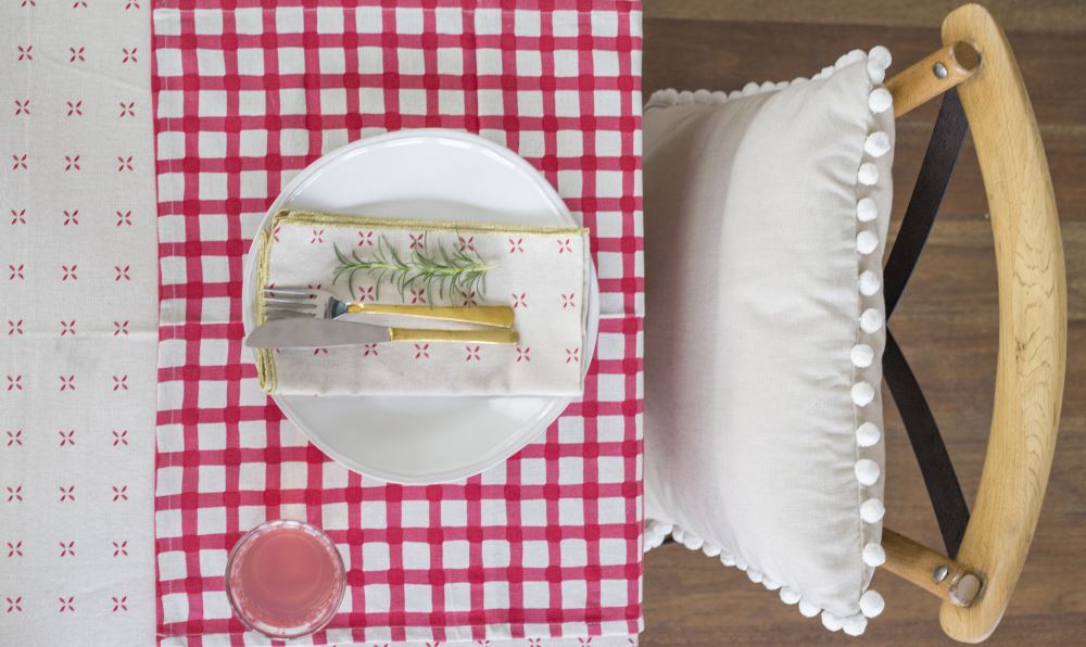 Vibrant cherry red gingham napkin set of four, 100% cotton, perfect for elevating any dining occasion.