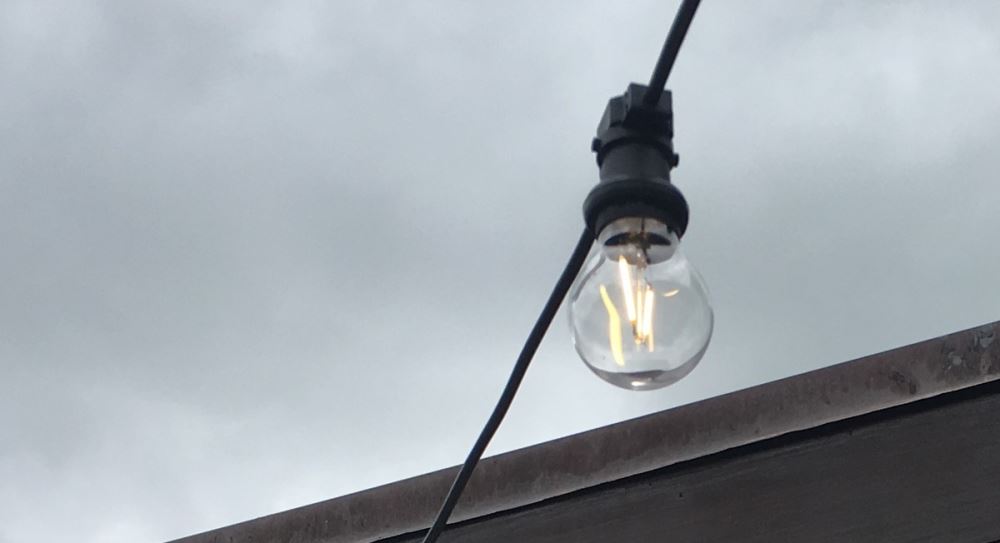 Low-voltage festoon party lights with 14 LED bulbs, suitable for indoor/outdoor use, enhancing events with soft ambiance.