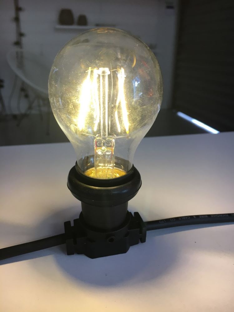 Festoon party lights with 14 durable LED bulbs on 10M wire, perfect for indoor/outdoor use and creating a soft ambiance.