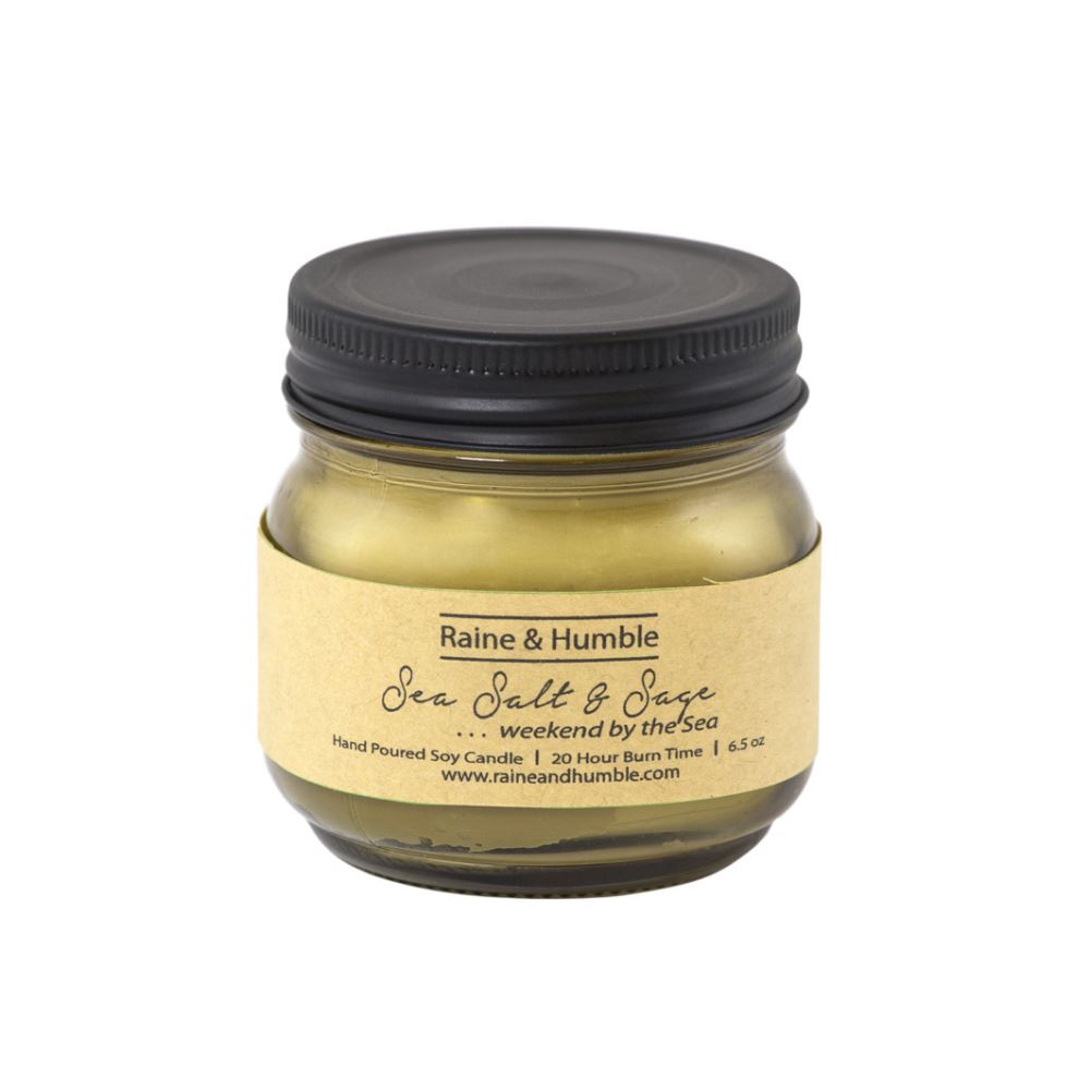A hand-poured soy candle in a heat-resistant glass, featuring sea salt and sage aromas for a calming coastal ambiance.