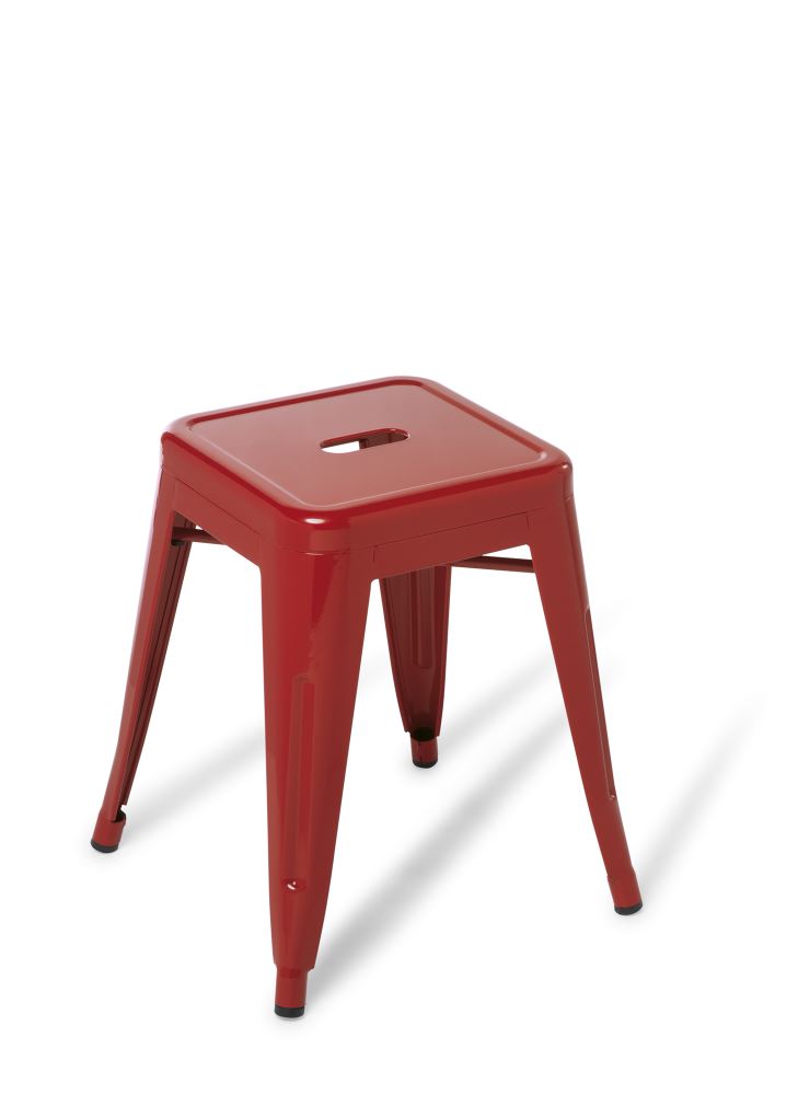 Low red stool with a sturdy steel frame, stackable design, ideal for small spaces and modern decor.