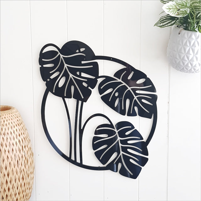 Large black ACM wall art featuring a Monstera Deliciosa leaf, perfect for adding elegance to any indoor or outdoor space.