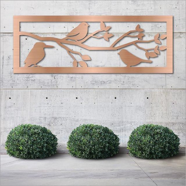 Large wall art panel featuring 3 birds in brushed copper, perfect for indoor/outdoor decor, 790mm x 285mm.