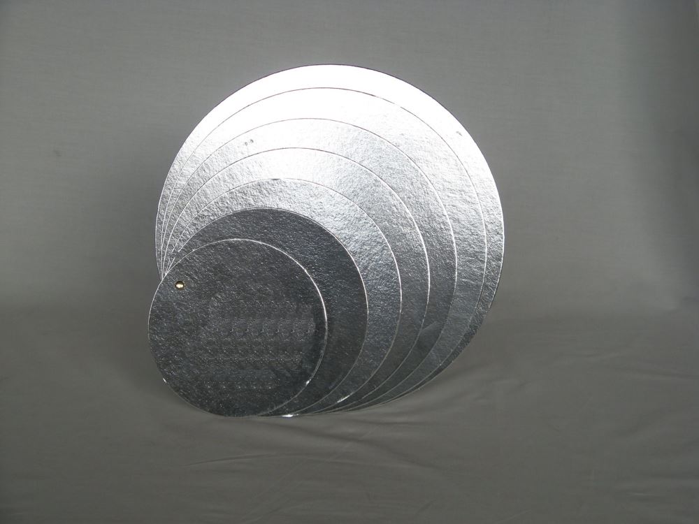 Clearance set of 10 durable 4" silver foil-lined cake boards for elegant presentation of cakes and desserts.
