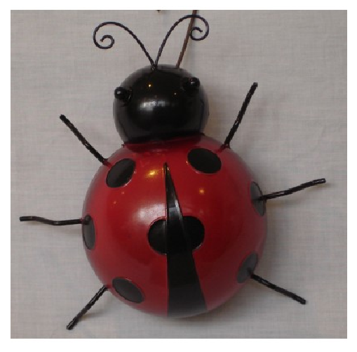 Large metal wall art of a ladybug, vibrant and colorful, perfect for adding character to any space.