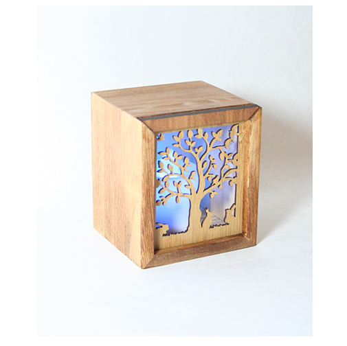 LED tealight box in bamboo with tree and rabbits design, includes color-changing candle, ideal as a gift or trinket holder.