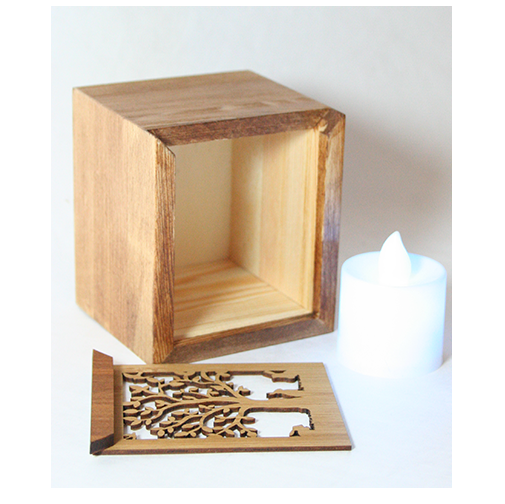 LED tealight box made of bamboo with tree and rabbit design, includes color-changing LED candle, also serves as trinket box.