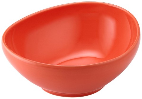 Vibrant coral porcelain serving bowl, perfect for salads and pasta, ideal for shared meals and festive gatherings.