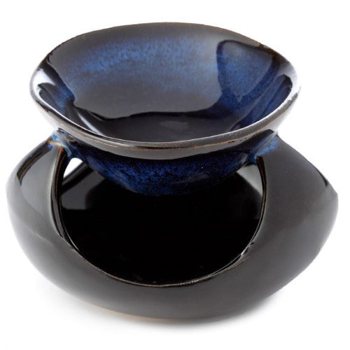 Ceramic oil burners in abstract dark mottled design, enhancing ambiance and aromatherapy in any space.