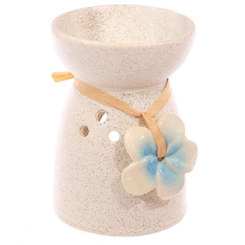 Set of 3 speckled cream ceramic oil and wax burners with floral designs, perfect for creating a soothing home ambiance.