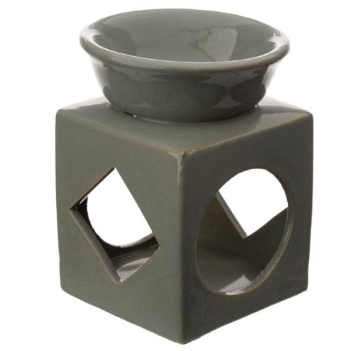 Set of 3 ceramic oil and wax burners with geometric cut-outs, enhancing ambiance and fragrance in any room.