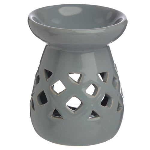 Ceramic oil and wax burners in pastel colors with cut-out lattice design, ideal for creating cozy aromas and ambiance.