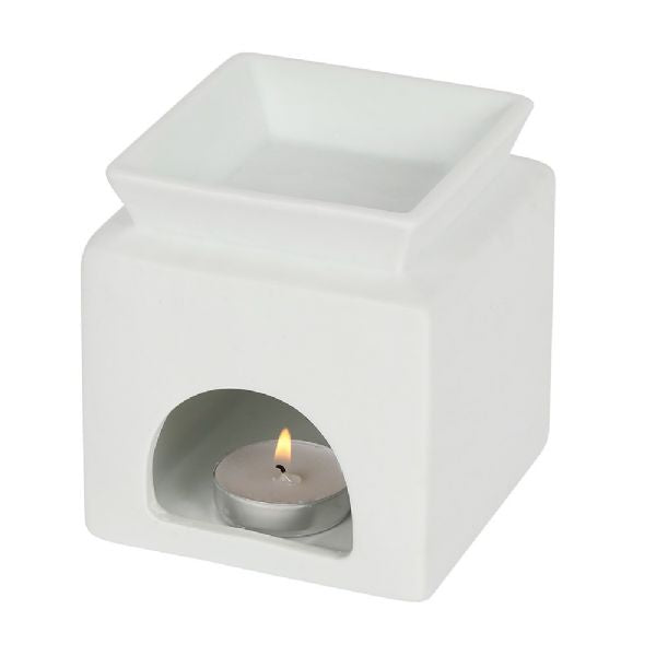 White ceramic oil burner with family cut-out design, perfect for creating a cozy atmosphere and releasing soothing scents.