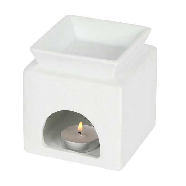 White ceramic oil burner with heart cut-out and 'love' text, perfect for enhancing home ambiance with calming fragrances.