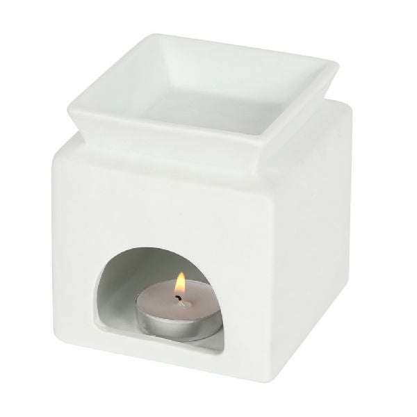 White ceramic oil burner with heart cut-out and 'home' text, designed for aromatherapy and elegant home décor.