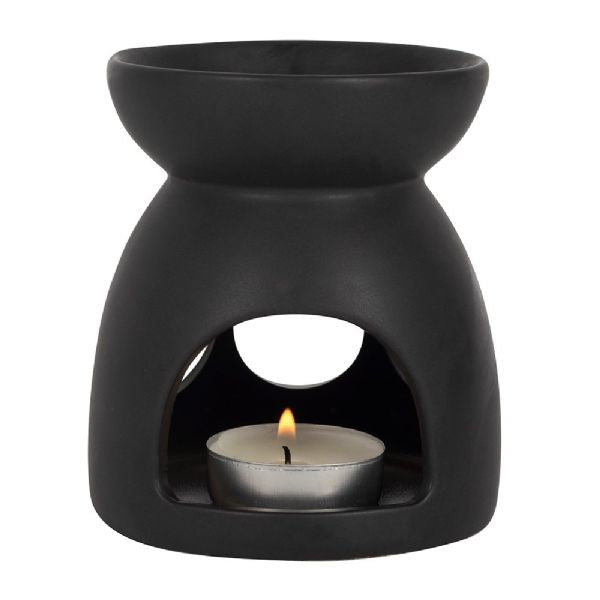 Black ceramic oil burner with triple moon cut-out, perfect for aromatherapy and Halloween decor, measuring 10x9x9 cm.