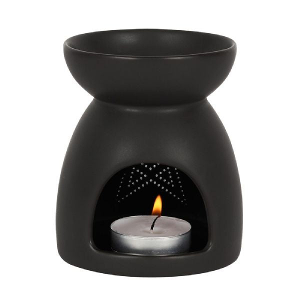 Black ceramic oil burner with pentagram cut-out design, perfect for spooky decor and compatible with oils and wax melts.