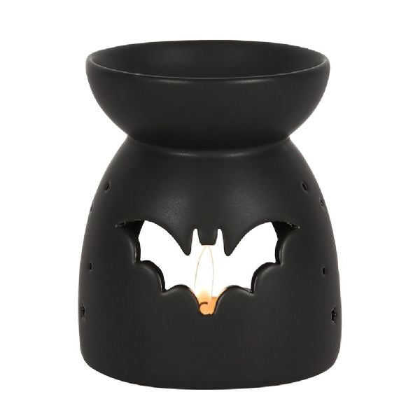 Black ceramic oil burner with bat cut-out design, perfect for Halloween ambiance and compatible with fragrance oils and wax melts.