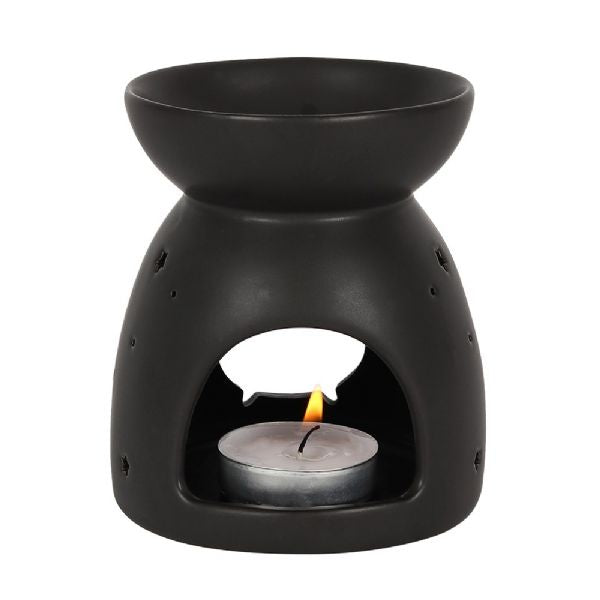 Black ceramic oil burner with cauldron cut-out design, perfect for aromatherapy and Halloween decor.