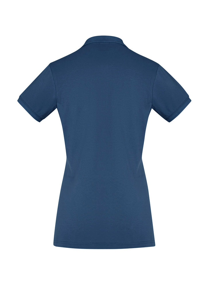 Ladies City Polo in Mineral Blue, featuring a waffle knit collar, breathable stretch fabric, and UPF 50+ sun protection.