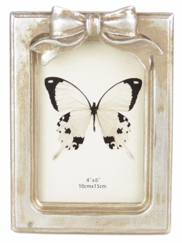 Elegant rectangular champagne frame with bow, perfect for displaying photos and enhancing home decor.