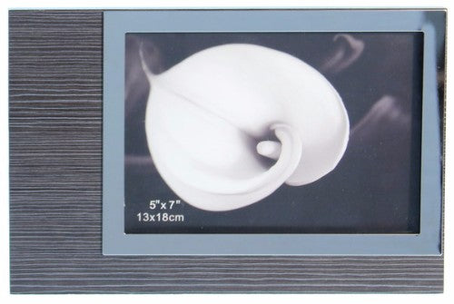 Elegant wooden veneer accessory with polished stainless steel accents, perfect for enhancing decor in any interior setting.