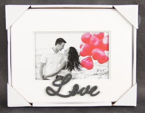 Elegant 4x6 photo frame inscribed with "Love," perfect for displaying cherished memories in any room.