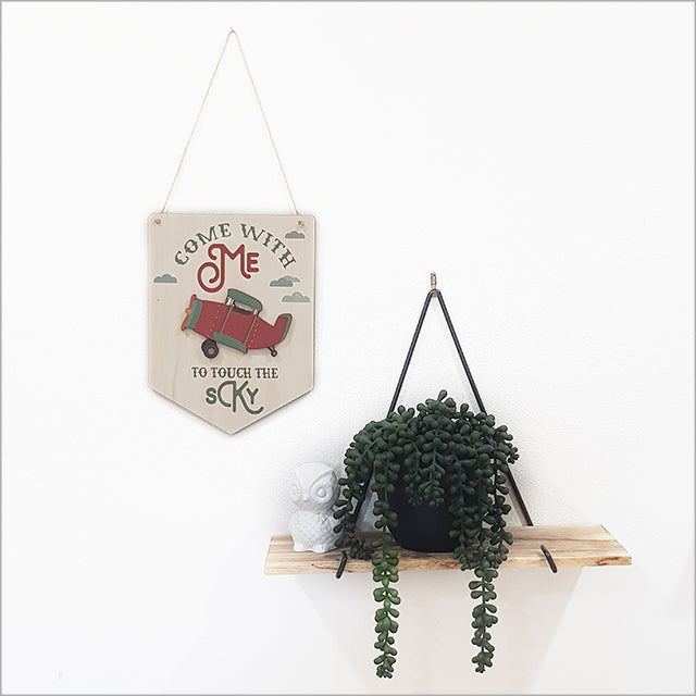 Wall art featuring a printed pine flag plane, crafted from eco-friendly materials for stylish, sustainable decor.