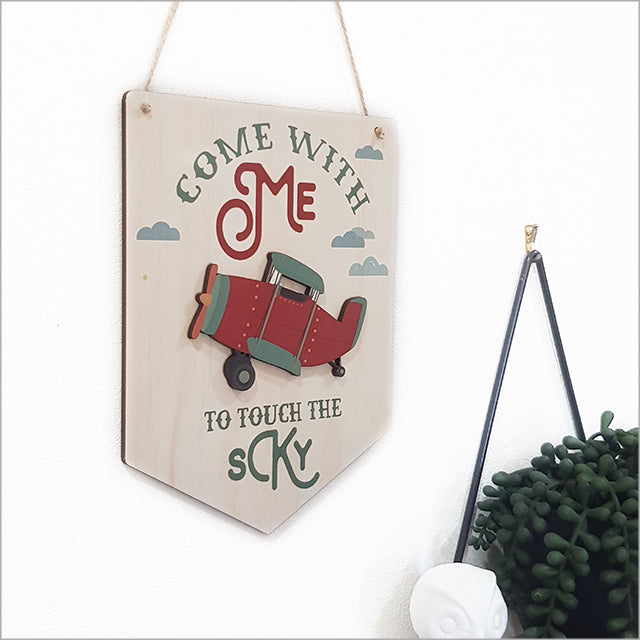 Wall art featuring a printed pine flag plane, crafted from eco-friendly veneer, ideal for aviation lovers and rustic decor.