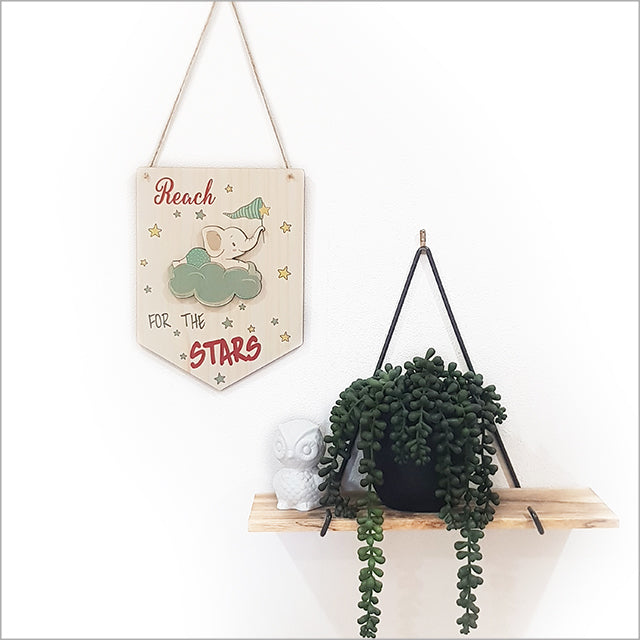 Wall art featuring a printed pine flag with a "Reach Stars" design, crafted from eco-friendly pine veneer, ready to hang.