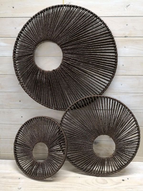 Set of 3 brown round wall hangings in varying sizes for a cozy and elegant decor touch. Ideal for any interior style.