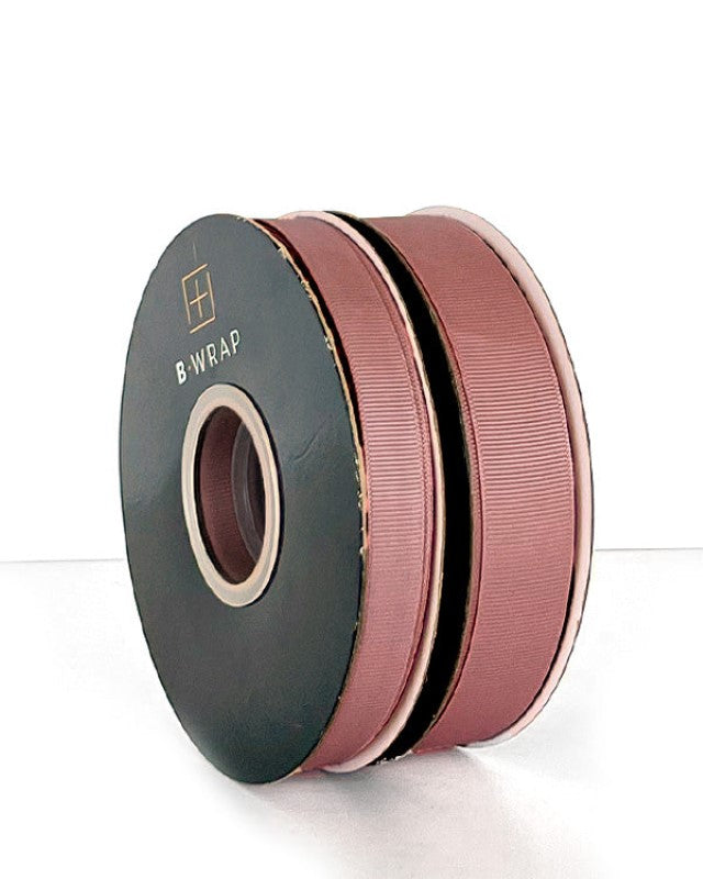 Dusty pink grosgrain ribbon, 22mm wide and 30m long, ideal for crafting, gift wrapping, and decorating events.