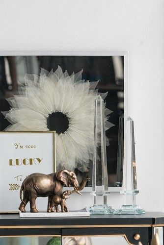 Elephant statue featuring a mother and baby, crafted from polyresin, adding charm to any space while symbolizing strength.